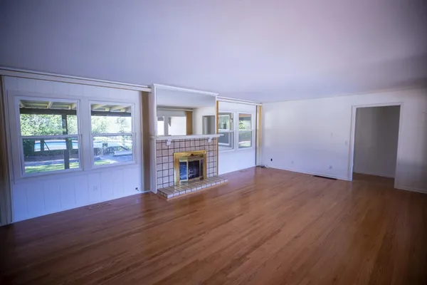 a view of an empty room and window