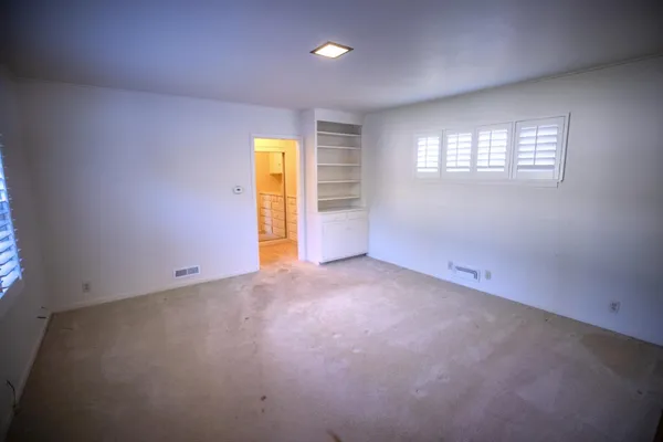 a view of an empty walk in closet