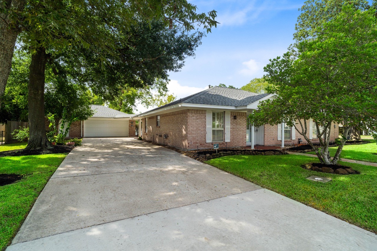 702 3rd Street Humble, TX 77338 - Photo 1 of 44 Cute as a button well maintained 1988sqft home in historic Humble. Ample parking with this driveway leading to a 2-car garage, as well as an extra driveway on the side leading to a covered, enclosed, carport.