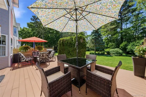 a view of a chairs and table in the patio