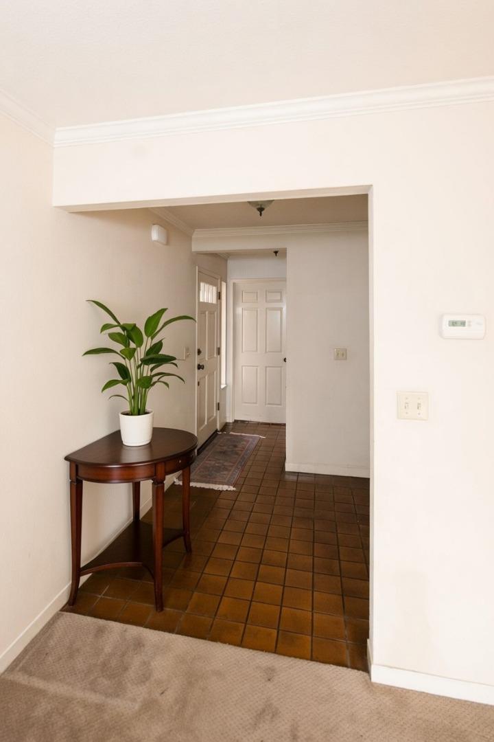 134 Nissen Road, Unit 2 Salinas, CA 93901 - Photo 13 of 27 a living room with a table and a potted plant
