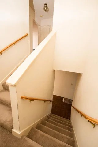 a spacious bathroom with a tub sink and mirror