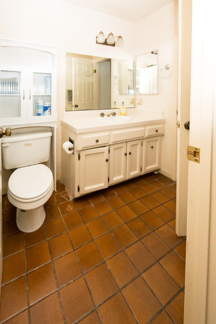 134 Nissen Road, Unit 2 Salinas, CA 93901 - Photo 20 of 27 a bathroom with a sink a toilet and a mirror