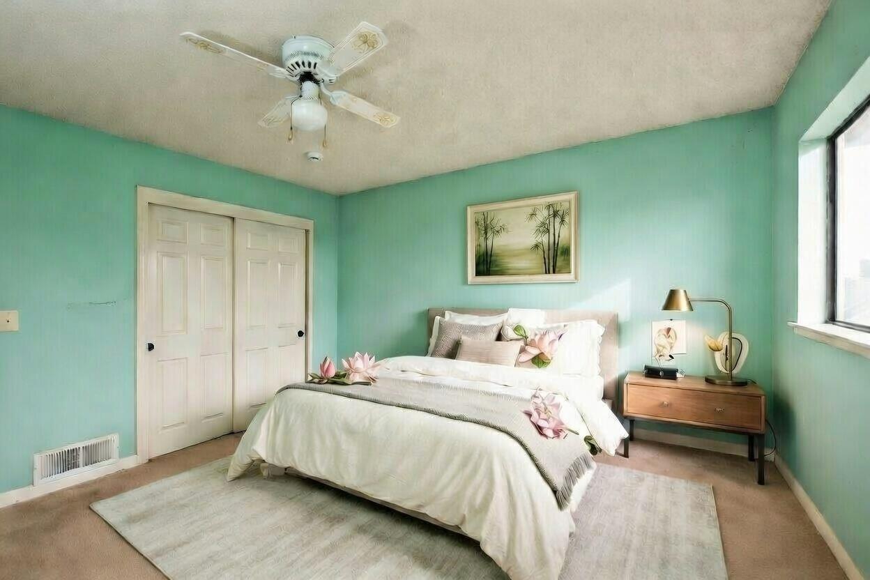 134 Nissen Road, Unit 2 Salinas, CA 93901 - Photo 21 of 27 a bedroom with a bed and a chandelier