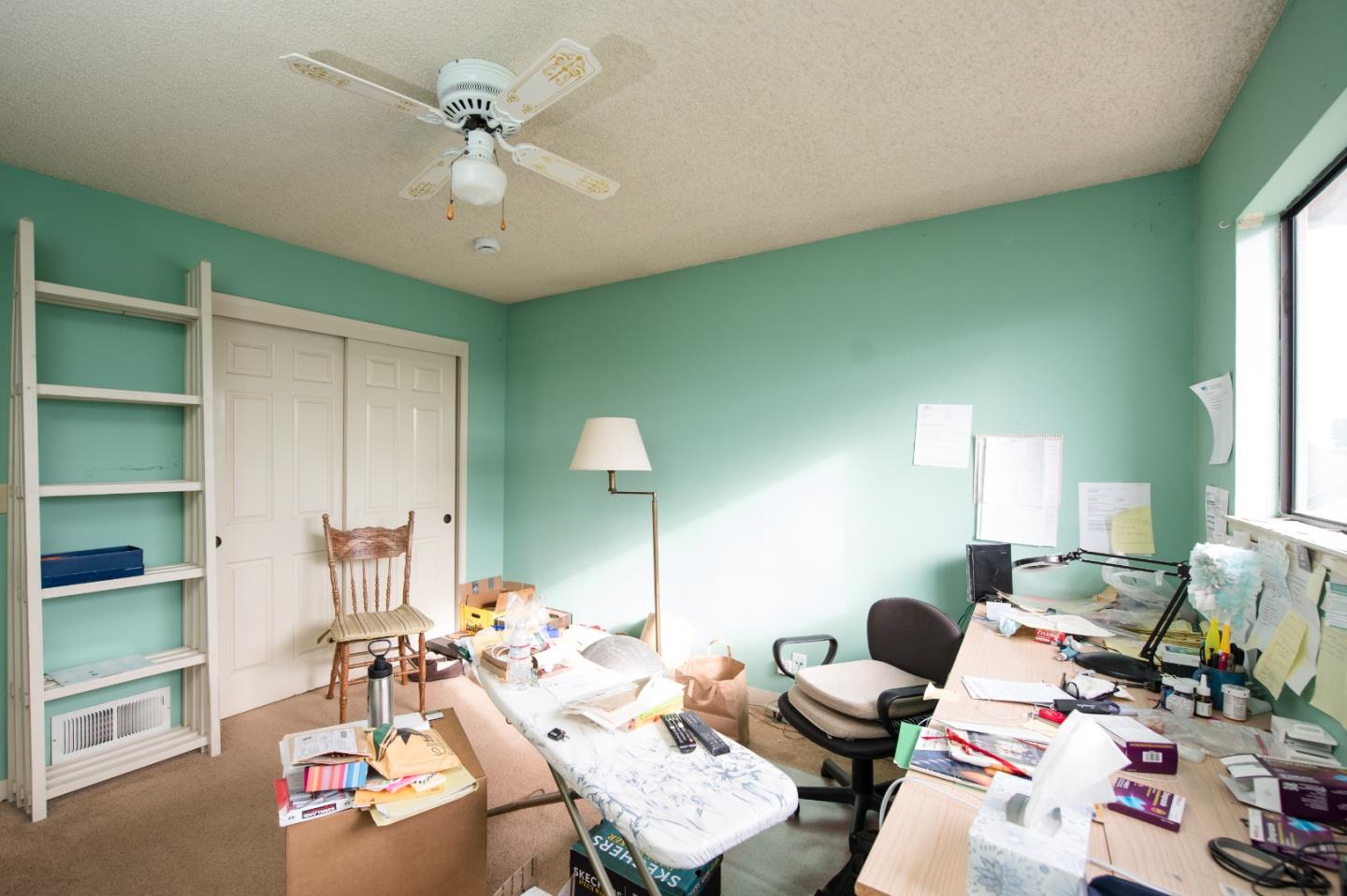 134 Nissen Road, Unit 2 Salinas, CA 93901 - Photo 22 of 27 a living room with furniture and a chandelier