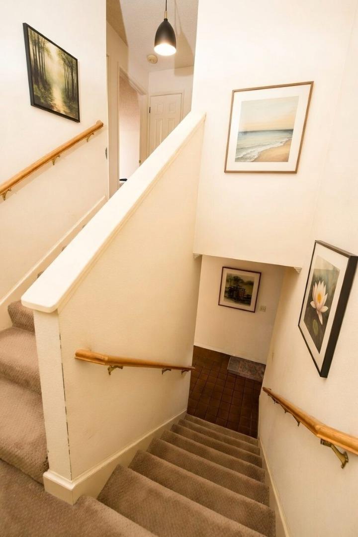 134 Nissen Road, Unit 2 Salinas, CA 93901 - Photo 23 of 27 a view of staircase with rug and white walls