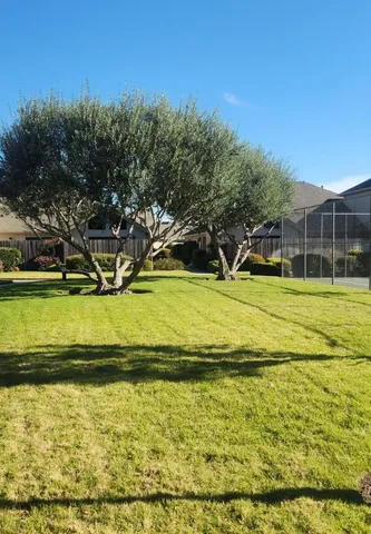 a view of a swimming pool with an outdoor space and seating area