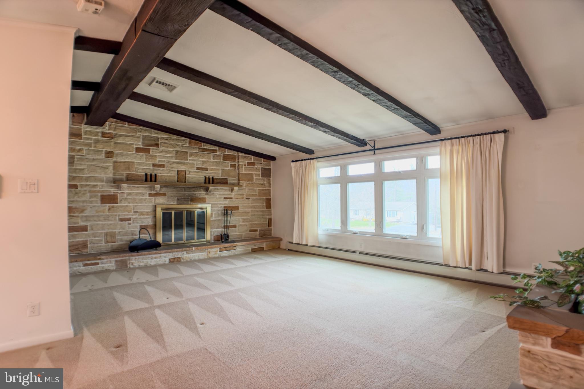 467 Swanger Road New Columbia, PA 17856 - Photo 13 of 45 Spacious living room with rustic charm.