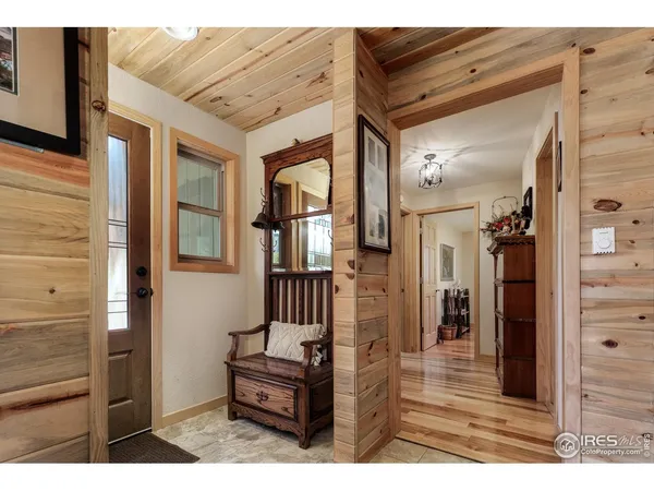 a view of living room kitchen and entryway