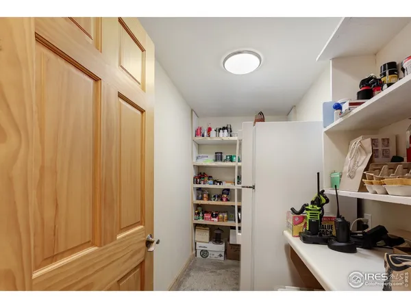 a kitchen with refrigerator and cabinets