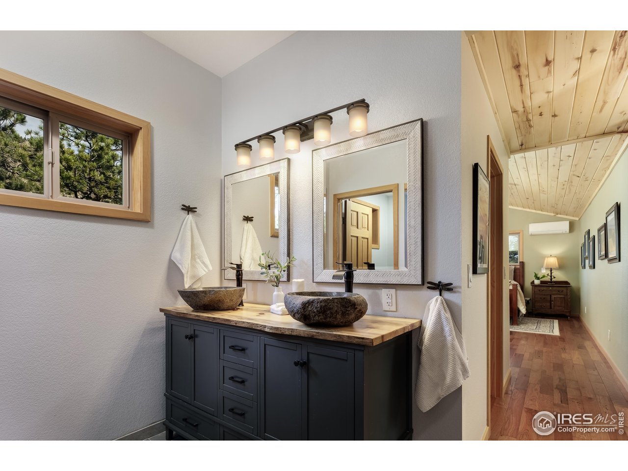 321 May Avenue Lyons, CO 80540 - Photo 24 of 50 a bathroom with a sink and a mirror