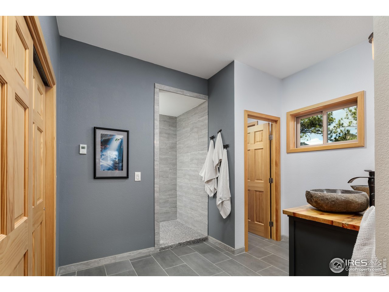 321 May Avenue Lyons, CO 80540 - Photo 25 of 50 a bathroom with a sink and a mirror