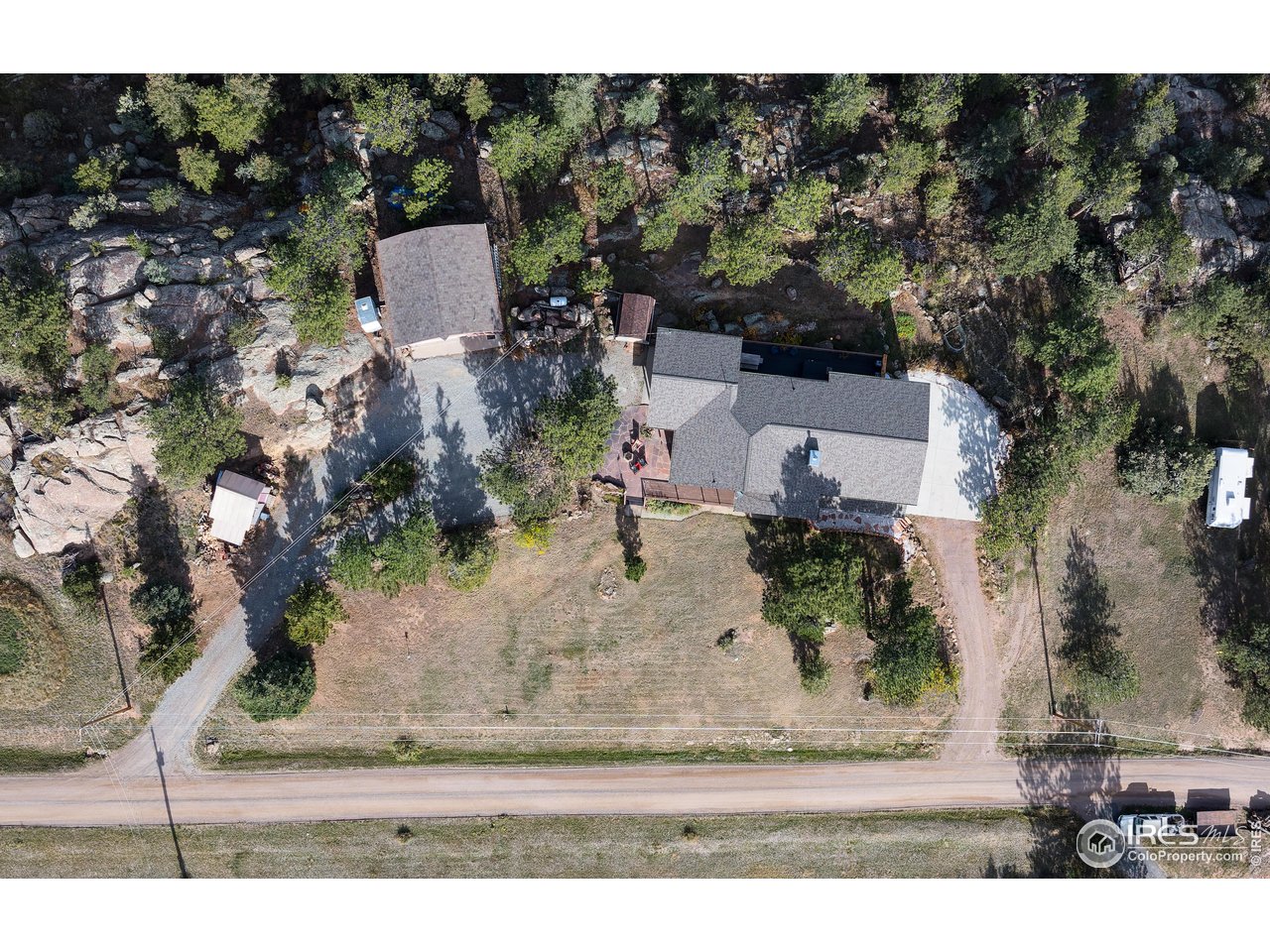 321 May Avenue Lyons, CO 80540 - Photo 47 of 50 an aerial view of a house with a yard basket ball court and outdoor seating