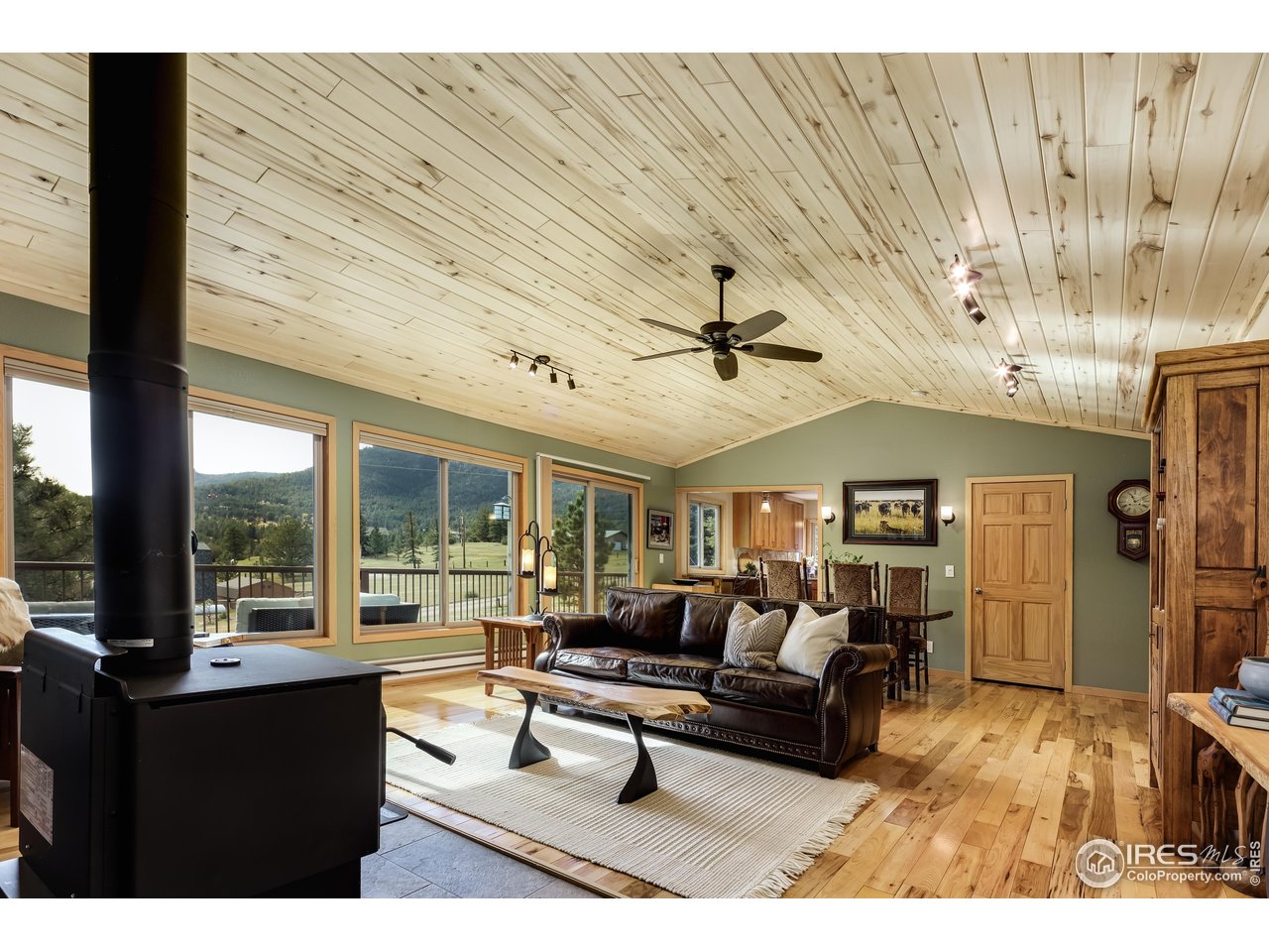 321 May Avenue Lyons, CO 80540 - Photo 6 of 50 a living room with furniture and a large window