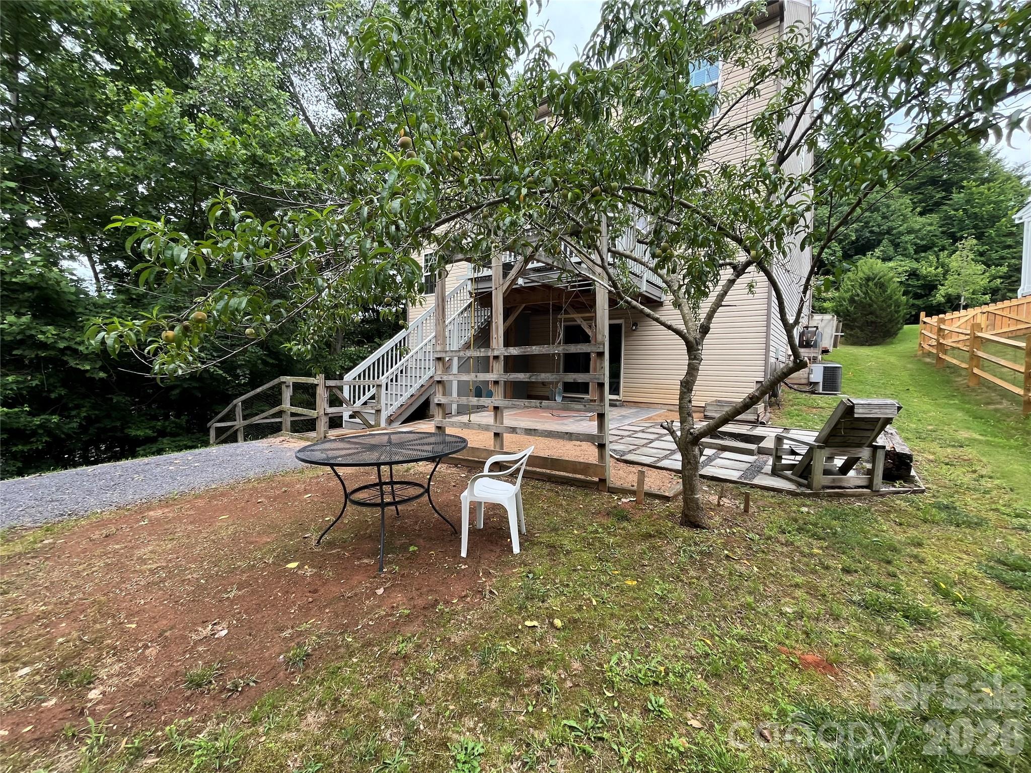 7532 West Berkeley Road, Unit 25 Denver, NC 28037 - Photo 33 of 36 a view of a house with backyard and sitting area