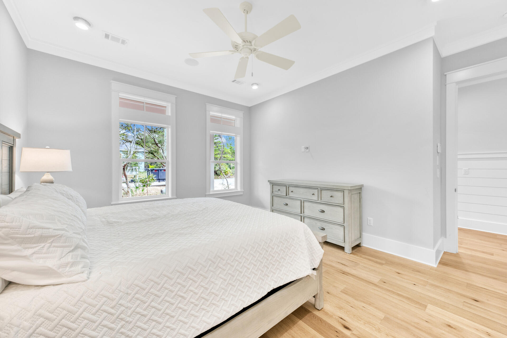 133 Dune Drive Santa Rosa Beach, FL 32459 - Photo 24 of 64 a bedroom with a large bed and a chandelier