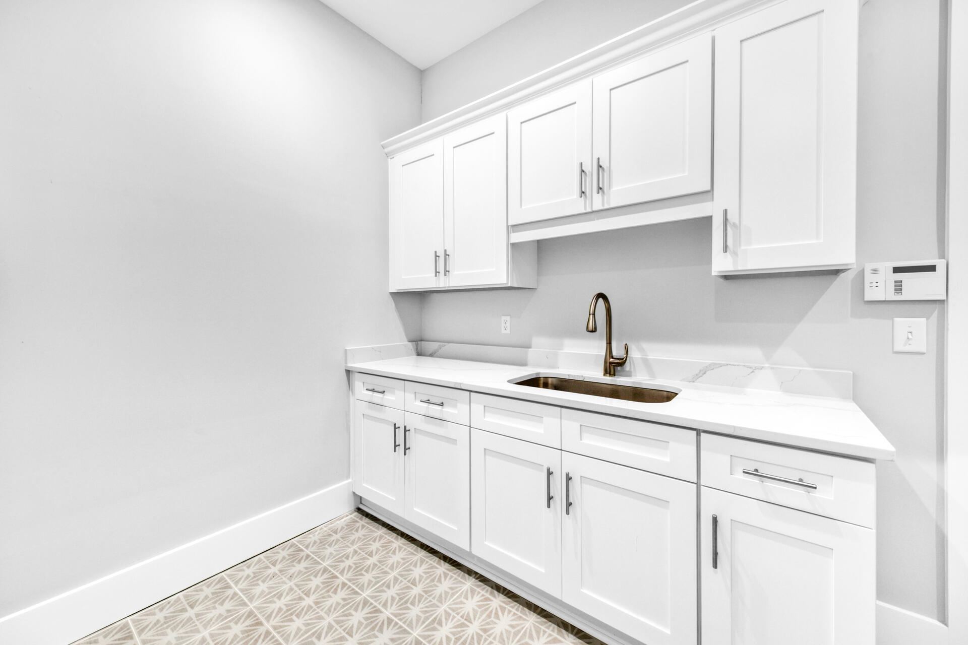 133 Dune Drive Santa Rosa Beach, FL 32459 - Photo 32 of 64 a kitchen with white cabinets and a sink