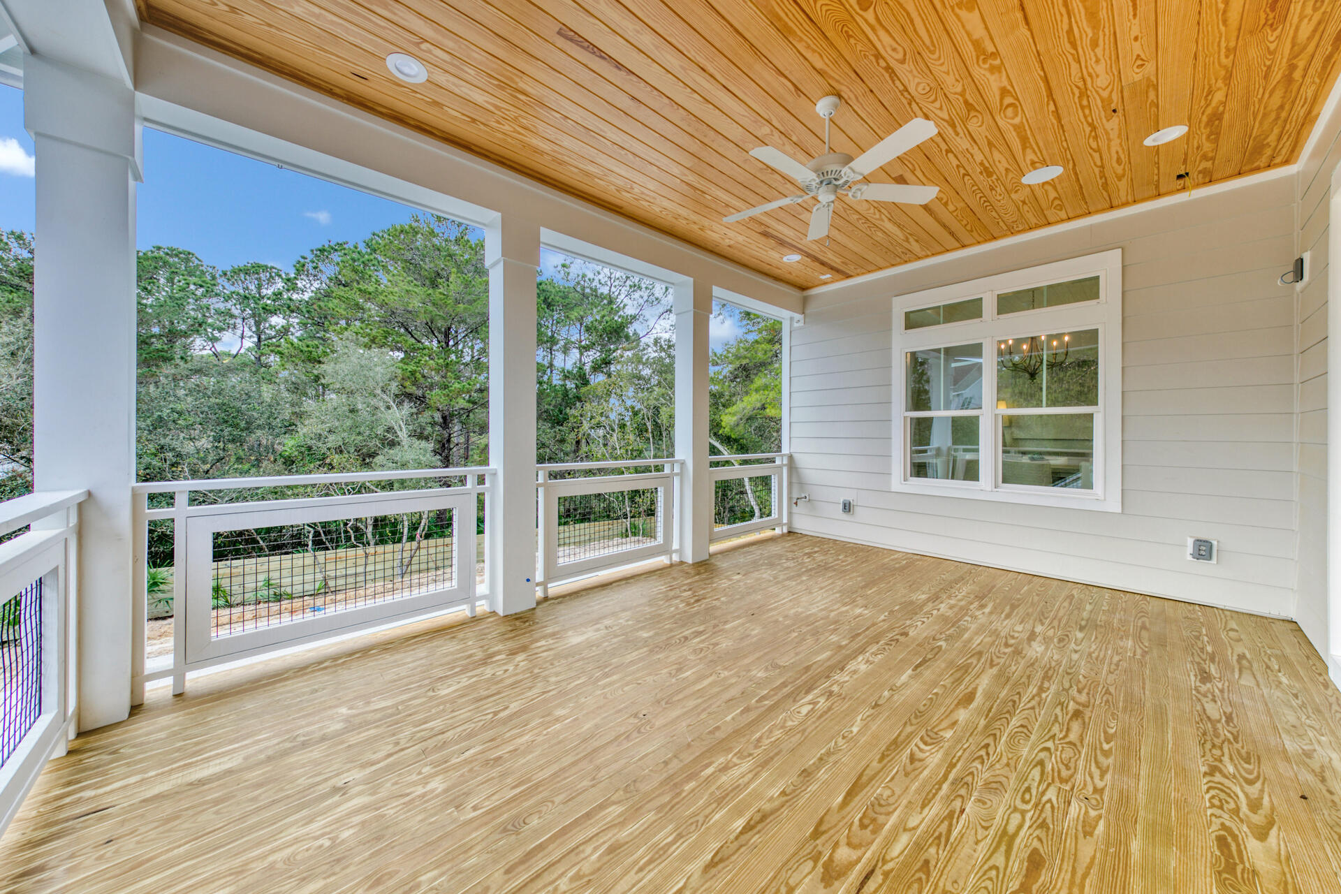 133 Dune Drive Santa Rosa Beach, FL 32459 - Photo 35 of 64 a view of empty room with wooden floor and fan