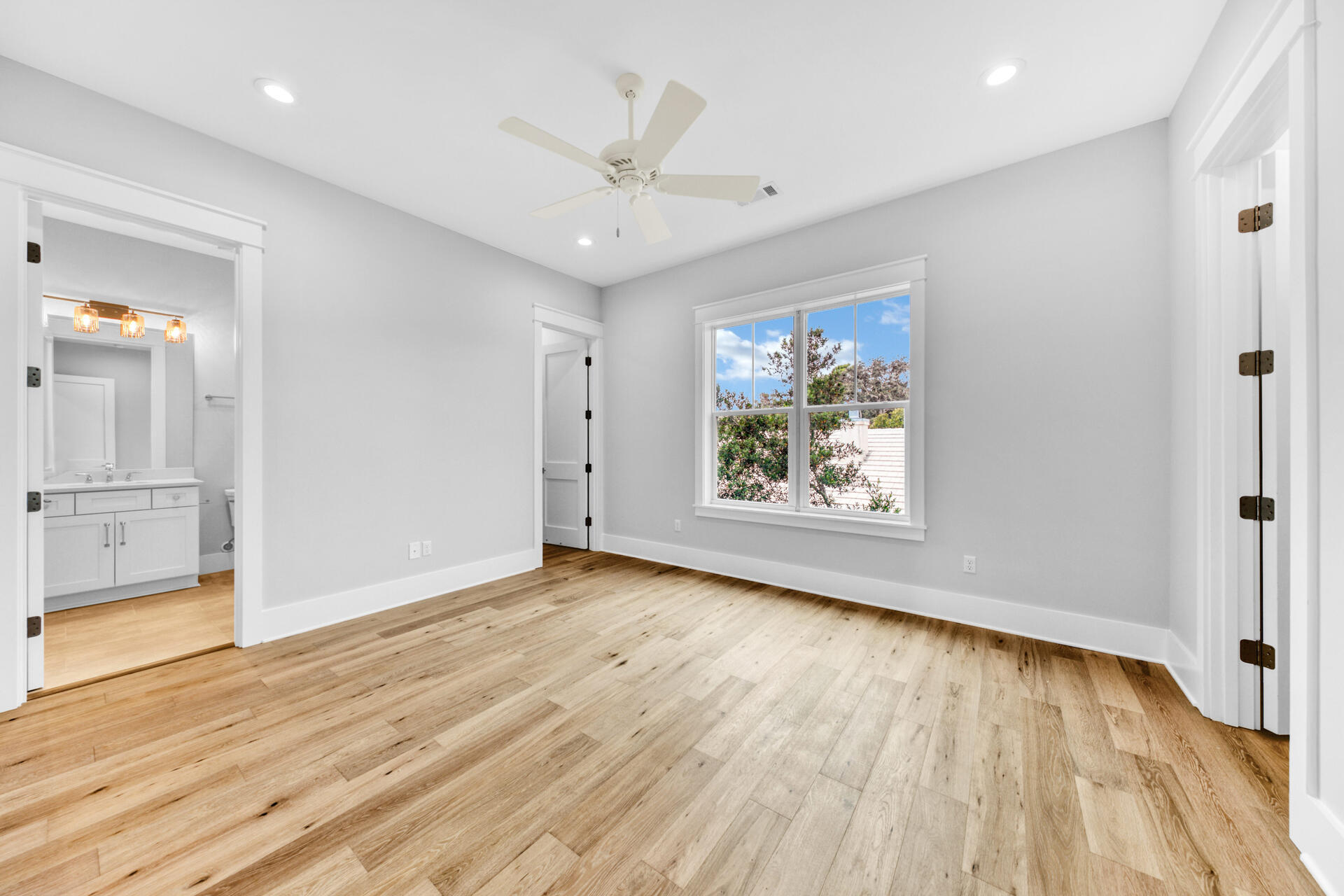 133 Dune Drive Santa Rosa Beach, FL 32459 - Photo 47 of 64 an empty room with wooden floor and windows