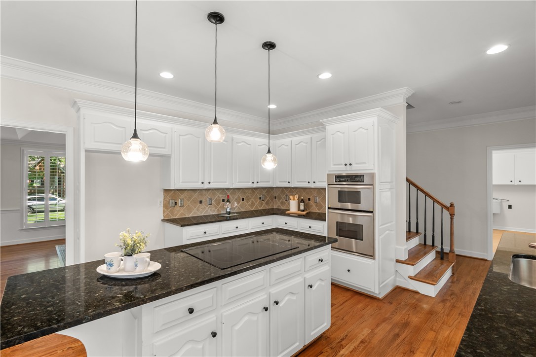 312 English Oak Road Simpsonville, SC 29681 - Photo 33 of 48 This spacious kitchen offers ample storage, modern appliances, and a beautiful view to the outside.