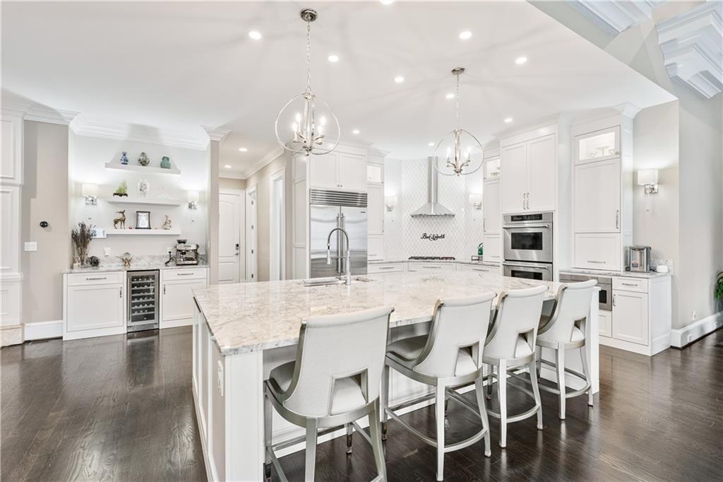 8760 Colonial Place Duluth, GA 30097 - Photo 3 of 5 a large kitchen with a table and chairs