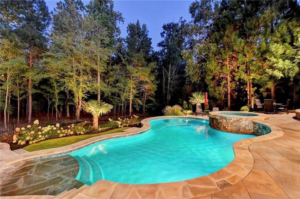 8760 Colonial Place Duluth, GA 30097 - Photo 5 of 5 a view of a backyard with swimming pool