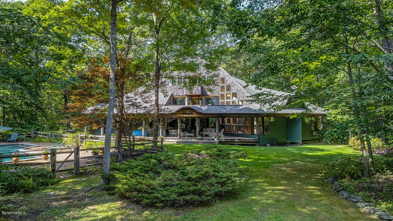 720 W Road Richmond, MA 01254 - Photo 14 of 16 a front view of a house with a garden