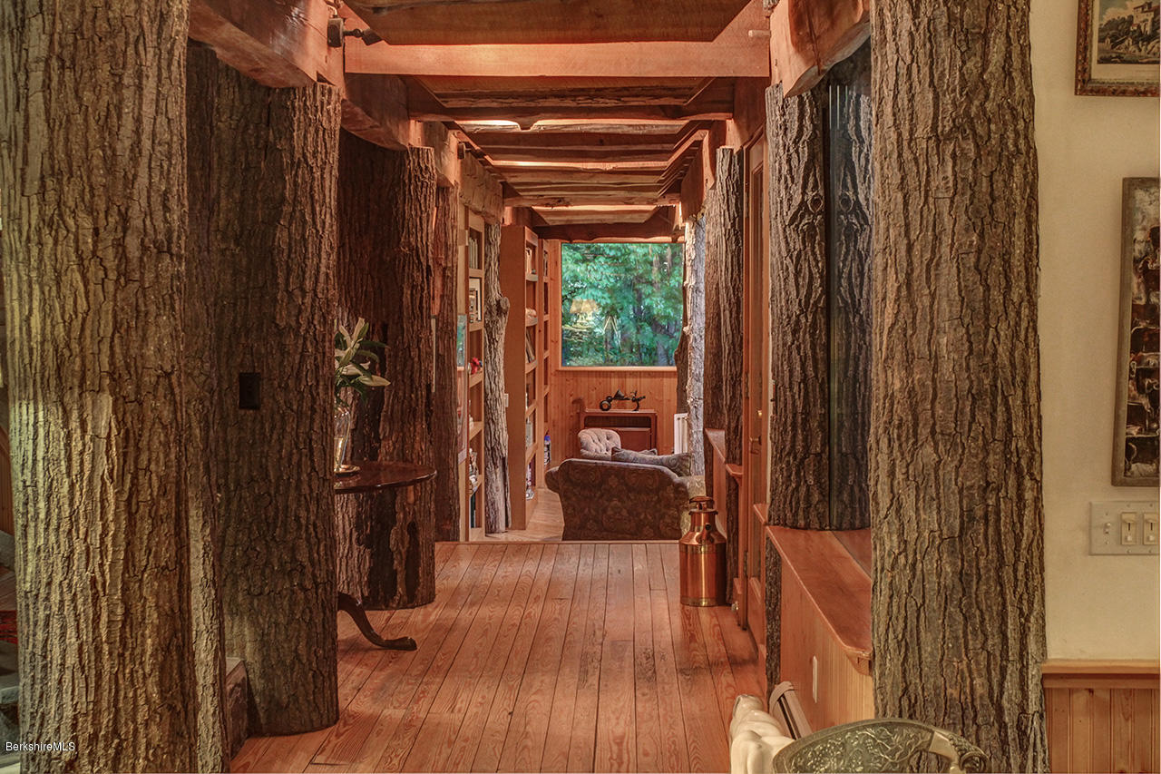 720 W Road Richmond, MA 01254 - Photo 8 of 16 a view of a porch with wooden floor and stairs