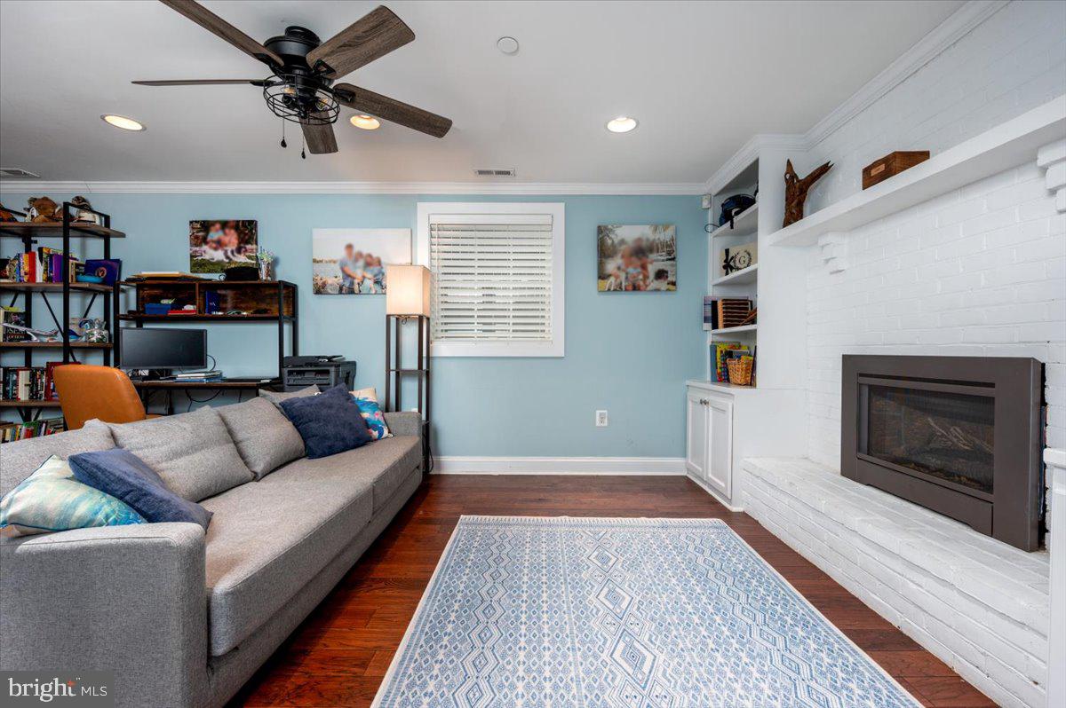 57 Spa Road Annapolis, MD 21401 - Photo 29 of 39 a living room with furniture and a fireplace