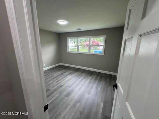 21 Appleton Drive Hazlet, NJ 07730 - Photo 16 of 24 an empty room with wooden floor and windows