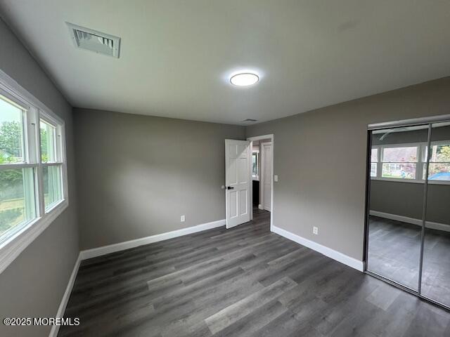 21 Appleton Drive Hazlet, NJ 07730 - Photo 17 of 24 an empty room with wooden floor and windows