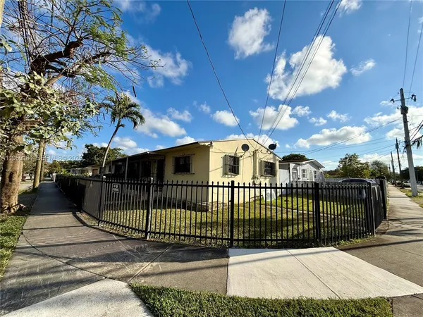 a view of a wrought iron fences in front of house