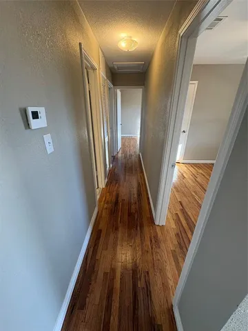 a view of entryway with wooden floor