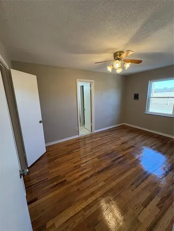 a view of livingroom with hardwood floor and ceiling fan