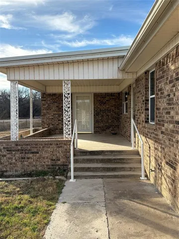 a front view of a house with a porch