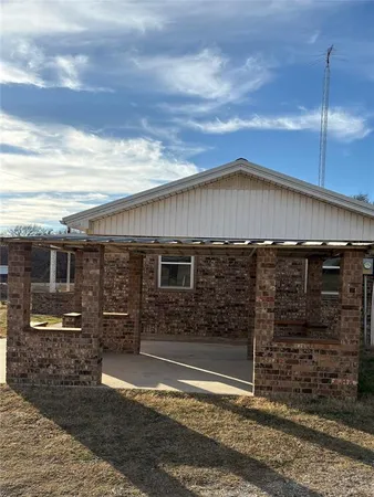 a front view of a house with parking space