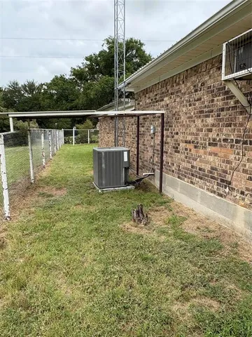 a view of outdoor space with deck and yard