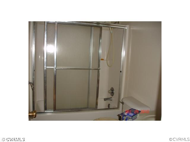 2714 Amherst Ridge Loop Colonial Heights, VA 23834 - Photo 11 of 12 a black and white photo of a bathroom