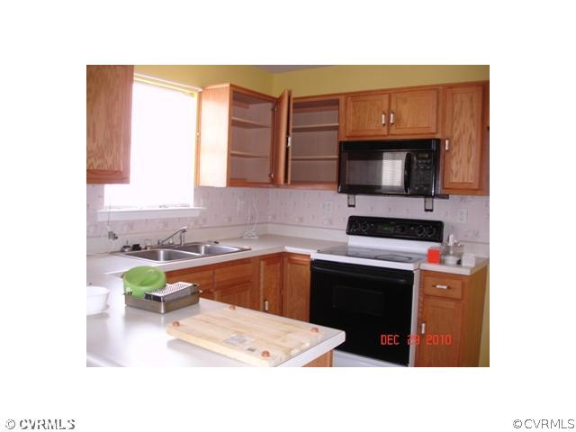 2714 Amherst Ridge Loop Colonial Heights, VA 23834 - Photo 5 of 12 a kitchen with a sink cabinets and stainless steel appliances
