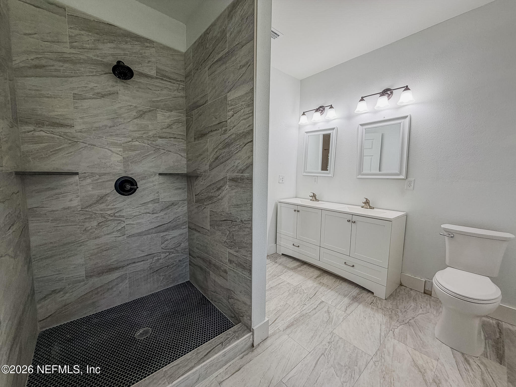 2589 Post Street Jacksonville, FL 32204 - Photo 11 of 19 a bathroom with a sink a toilet and shower