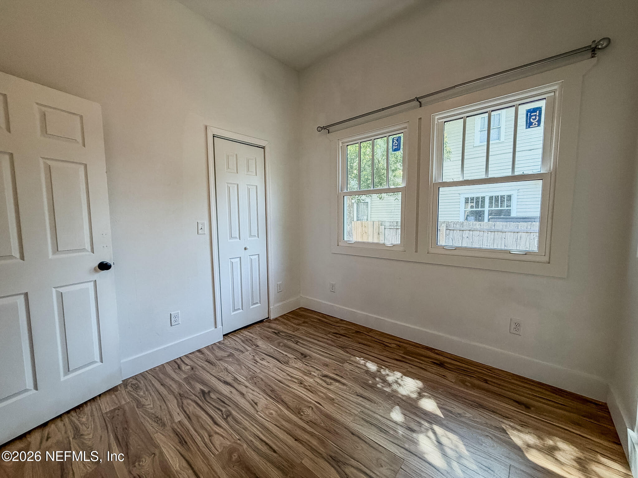 2589 Post Street Jacksonville, FL 32204 - Photo 15 of 19 a view of empty room with wooden floor and fan