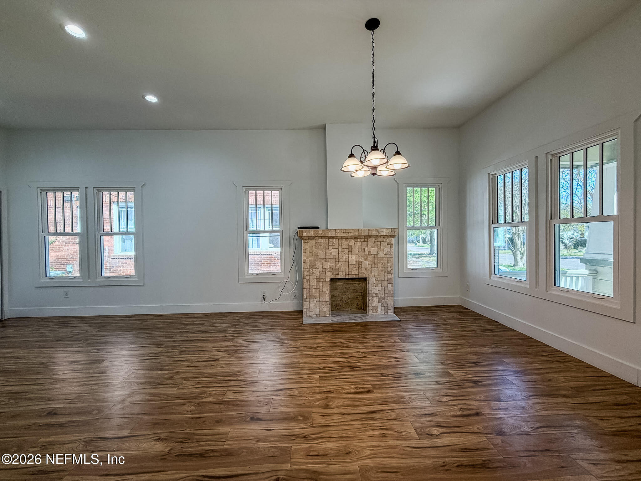 2589 Post Street Jacksonville, FL 32204 - Photo 4 of 19 a view of an empty room with chandelier and wooden floor
