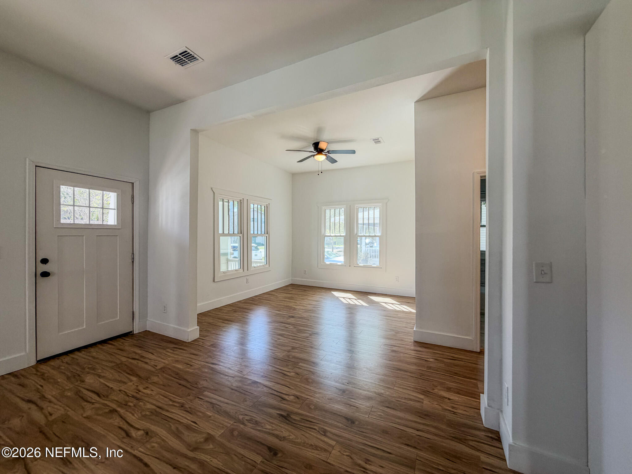 2589 Post Street Jacksonville, FL 32204 - Photo 7 of 19 a view of an empty room with window and wooden floor