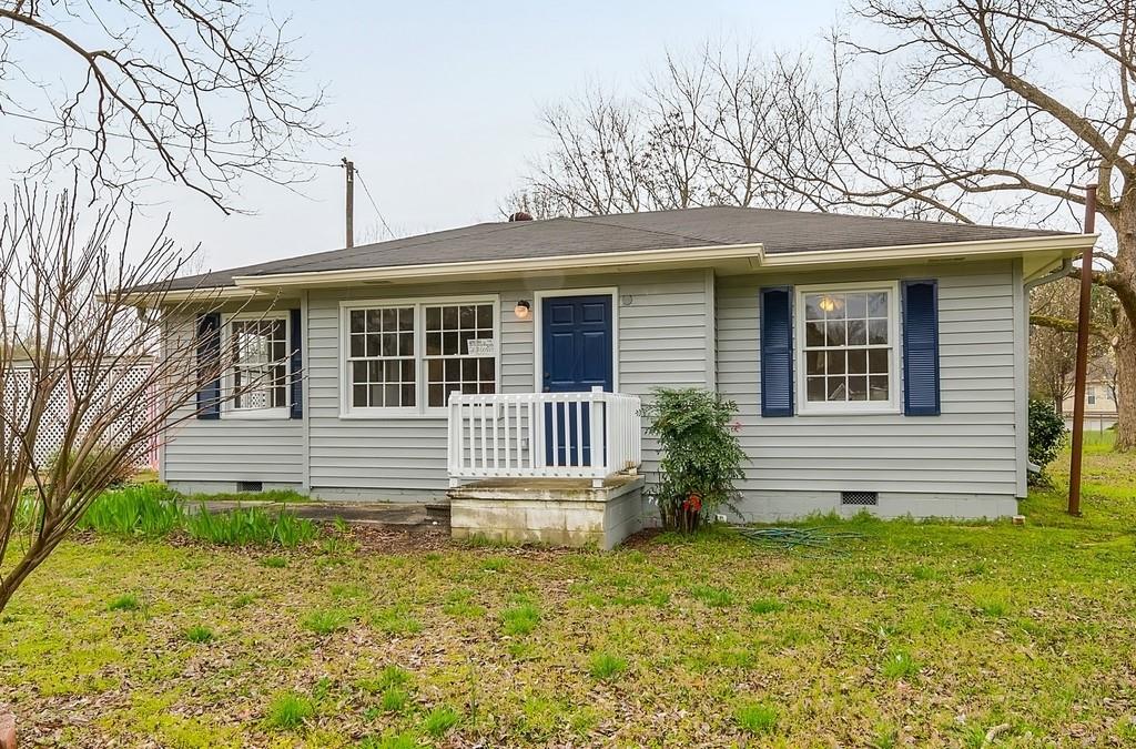 front view of a house with a yard