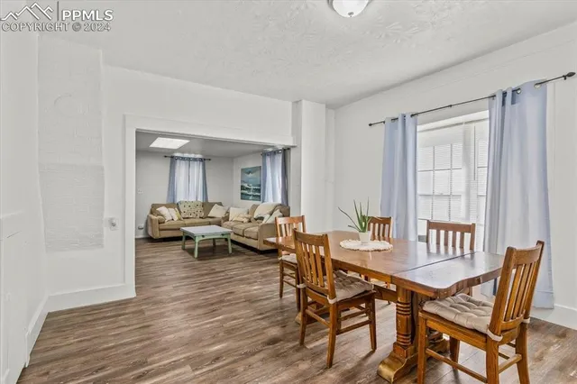 a view of a livingroom with furniture and window