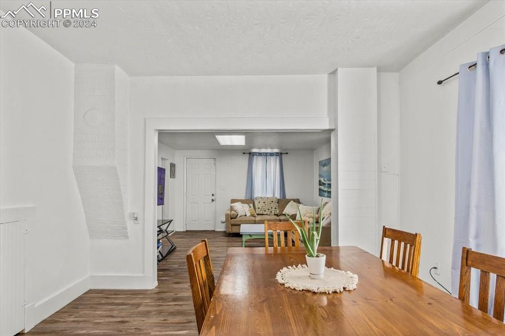 416 Wiley Avenue Swink, CO 81077 - Photo 12 of 43 a dining room with furniture and wooden floor
