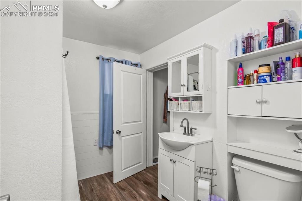 416 Wiley Avenue Swink, CO 81077 - Photo 19 of 43 a bathroom with a sink a vanity and a toilet
