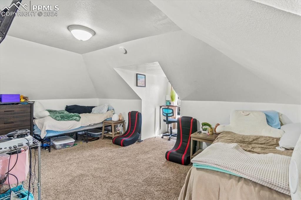 416 Wiley Avenue Swink, CO 81077 - Photo 27 of 43 a bedroom with furniture and a wooden floor