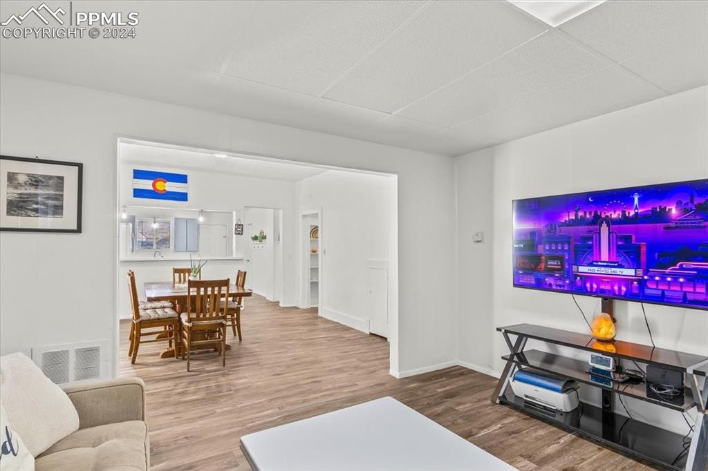 416 Wiley Avenue Swink, CO 81077 - Photo 3 of 43 a living room with furniture and a wooden floor