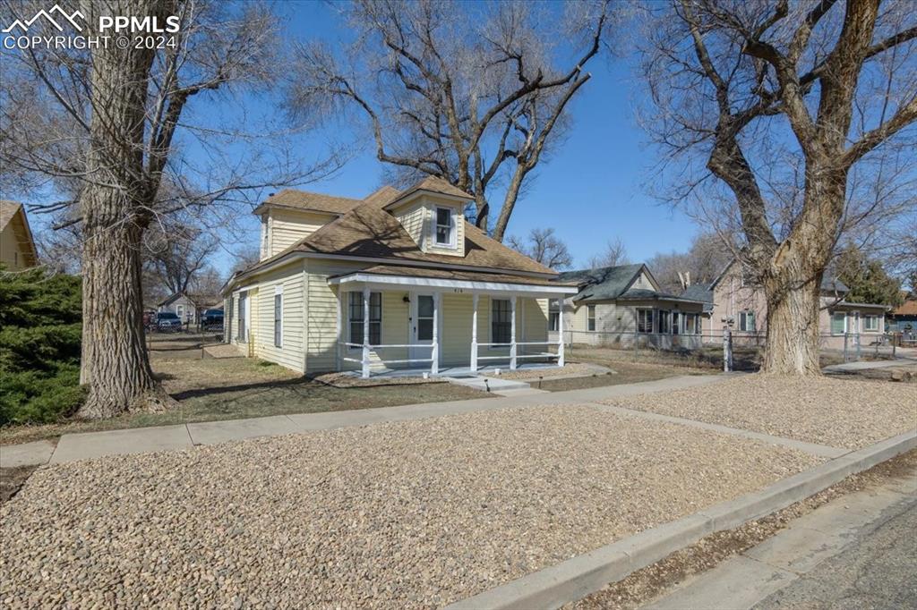 416 Wiley Avenue Swink, CO 81077 - Photo 40 of 43 a front view of a house with a garden
